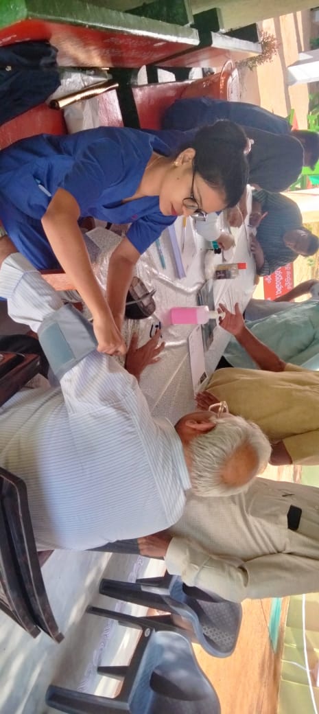 Checking BP at Health Camp.jpeg